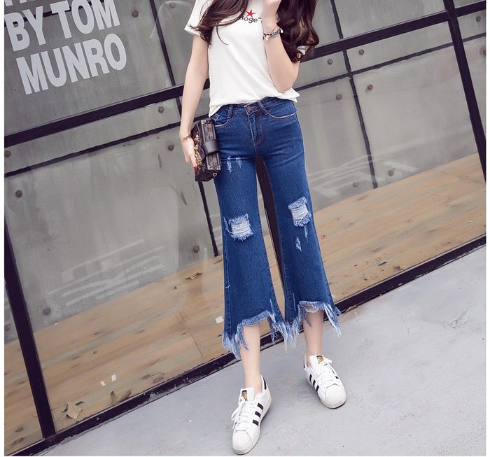 Wholesale-holes-worn-irregular-tassel-flare-jeans