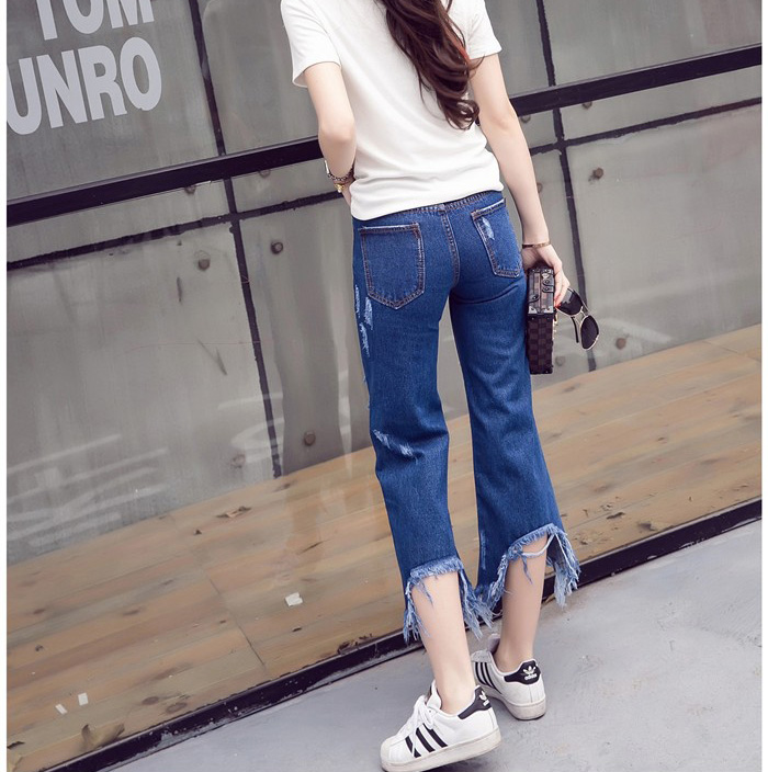 Wholesale-holes-worn-irregular-tassel-flare-jeans