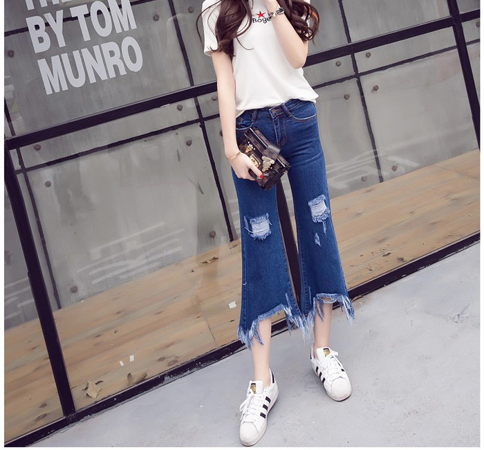 Wholesale-holes-worn-irregular-tassel-flare-jeans