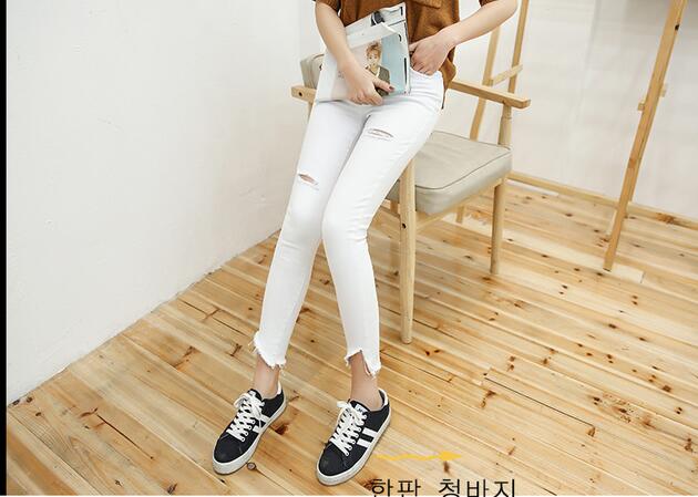 Female-hole-fringe-cut-jeans-pencil-pants-wholesale